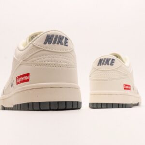 【AT2969】Supreme x Nike Dunk Low ホワイトブラウンのデュアルトーン。このアイテムは、伝統的な産業ラインデザインの制約を破ることを主張しています。