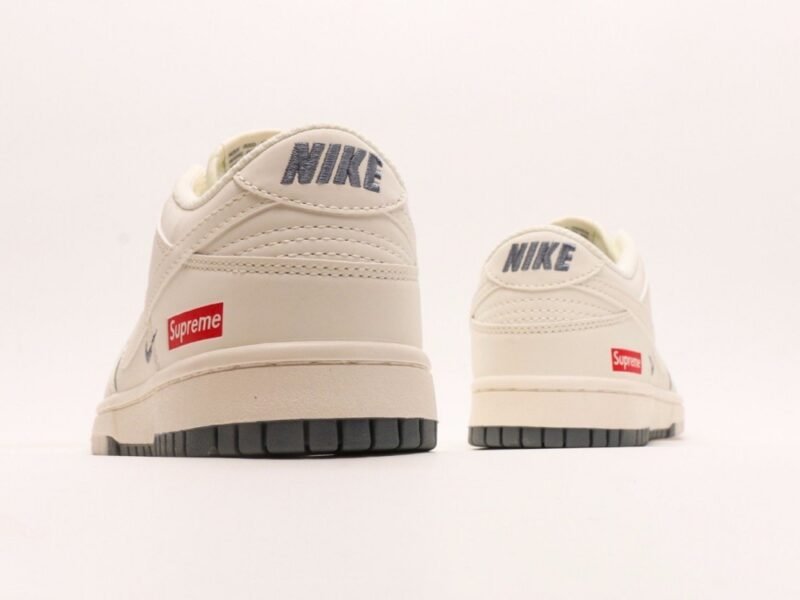 【AT2969】Supreme x Nike Dunk Low ホワイトブラウンのデュアルトーン。このアイテムは、伝統的な産業ラインデザインの制約を破ることを主張しています。